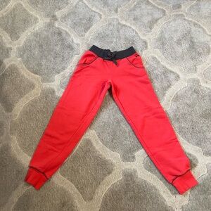 orange ish sweats, nike sportwear. 12-13 years for size